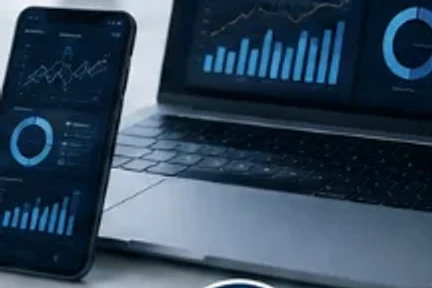 Smartphone and laptop displaying live analytics dashboards
